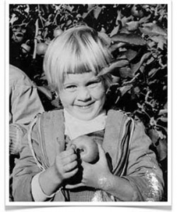 Little Girl Holding a Freshly Picked Apple