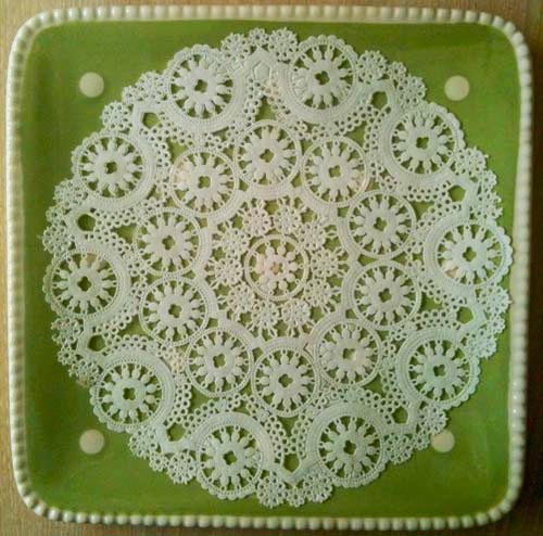 Green dotted plate with white doily for Easter Nests Candy