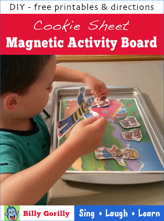 Boy playing with Billy Gorilly and friends on cookie sheet magnetic activity board